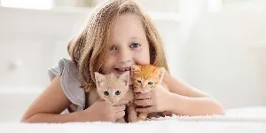 child and kittens