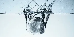 ice dropping into water