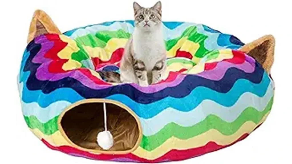 A cat sitting on a colorful cat bed.